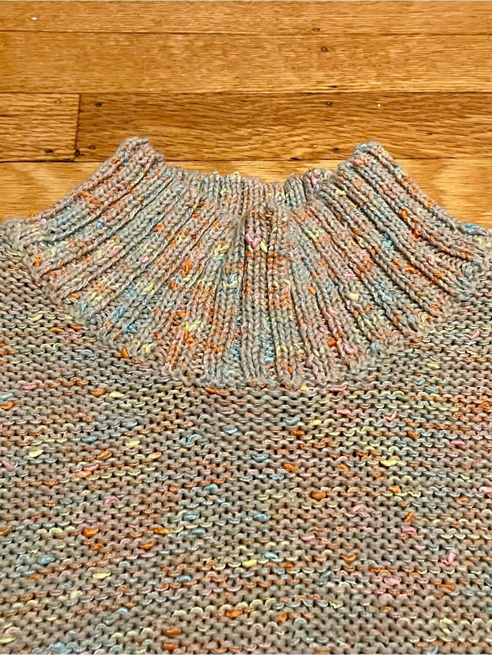 Knit mock neck sweater, sleeveless, grey with pastel confetti. Size small.